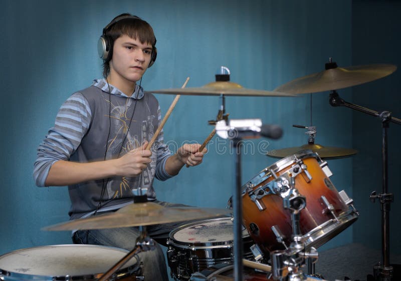 A young male drummer in action