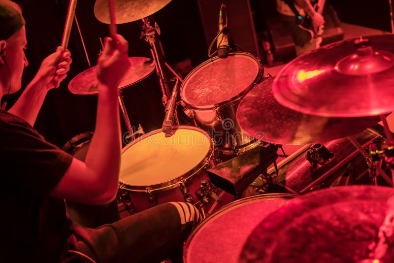 Drummer Beats on Steel Drum on Sidewalk in a Street Performance Stock