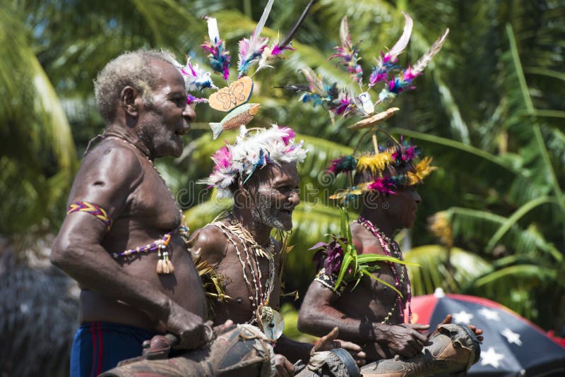 Traditional costumed men celebrate the typical rhythm of the village on Sepik River. Traditional costumed men celebrate the typical rhythm of the village on Sepik River