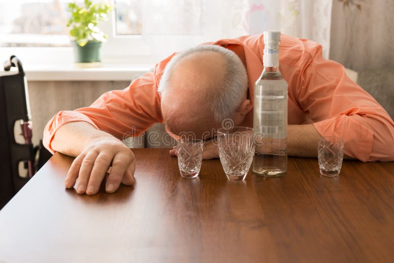 Drunk Bald Elderly Taking a Nap on the Table royalty free stock images Drunk Bald Elderly Taking a Nap on the Table royalty free stock images