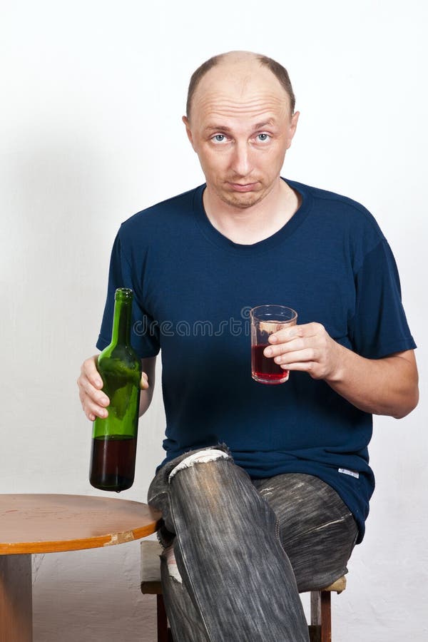 Drunk man holding a glass of red wine royalty free stock images Drunk man holding a glass of red wine royalty free stock images