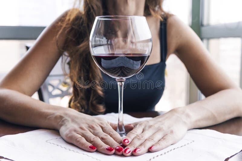 Drunk Woman Sitting At A Table And Holding A Glass Of Wine Close Up Female Alcoholism Stock 