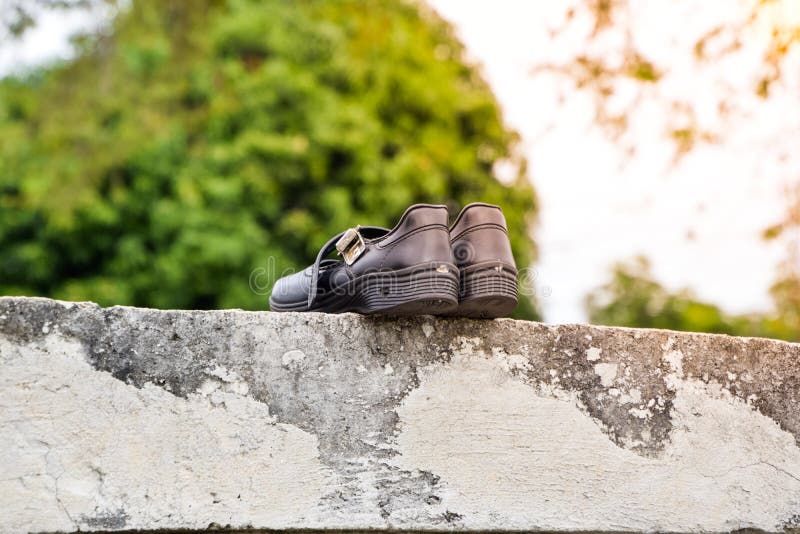Dry black student shoes in the sun stock photography Dry black student shoes in the sun stock photography