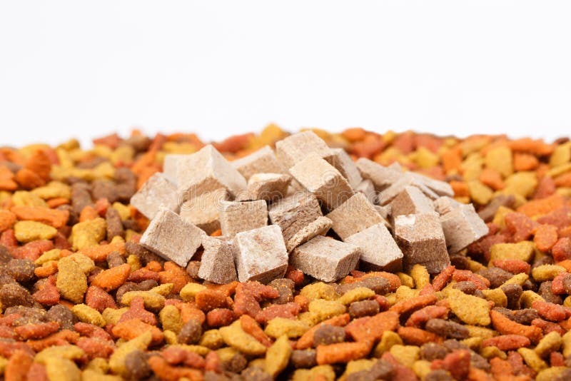 Dry cat dog food in granules. Pile heap of pet treats, dried chicken liver on white background. Colorful dry cat dog food in granules. Pile heap of pet treats stock photos Dry cat dog food in granules. Pile heap of pet treats, dried chicken liver on white background. Colorful dry cat dog food in granules. Pile heap of pet treats stock photos