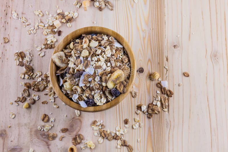 Dry Corn Flakes and Muesli and Glass of Milk on the Table. Top View