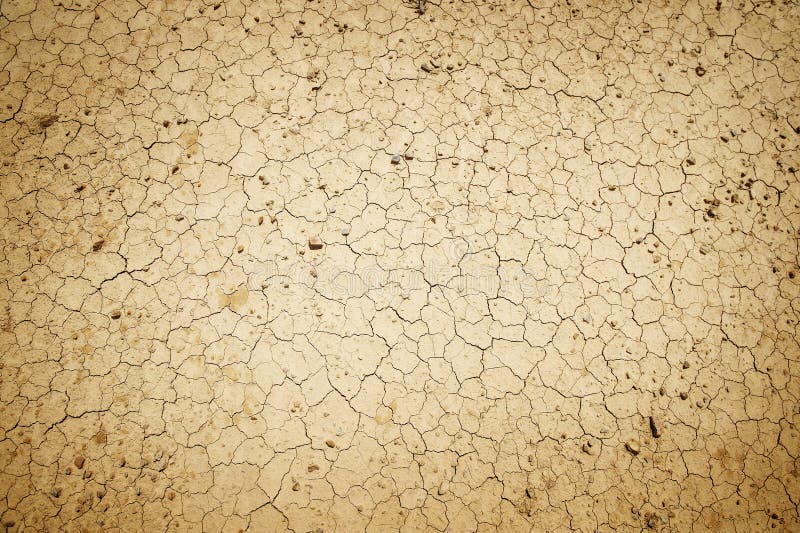 A view of dry, cracked dirt or mud. Suitable for an abstract background. A view of dry, cracked dirt or mud. Suitable for an abstract background.