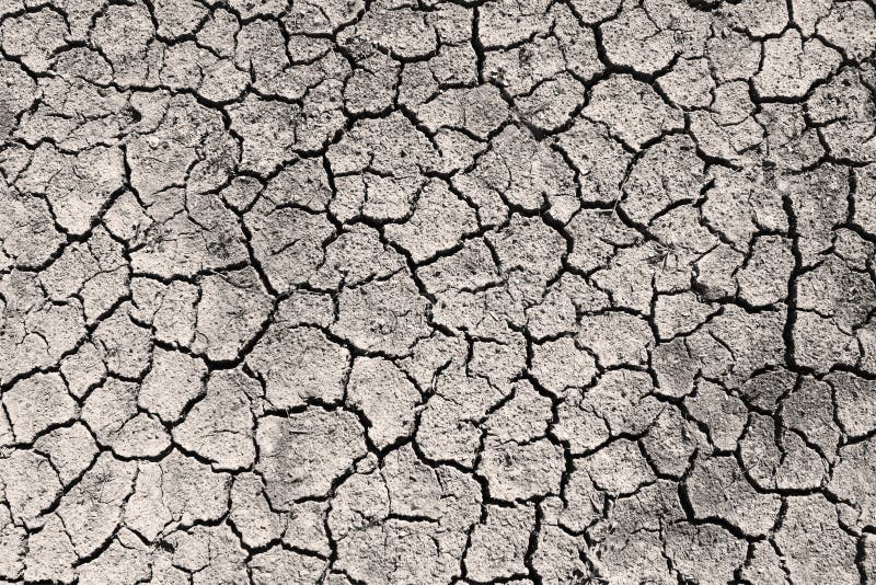 Dry cracked ground grayscale sepia toned photo stock images Dry cracked ground grayscale sepia toned photo stock images
