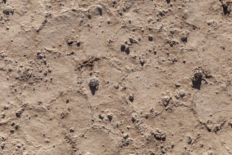 Dry earth with cracks on arid soil surface seen from above. Environmental signs of climate change and global warming