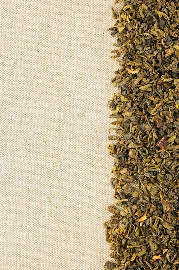 Dry green tea leaves on a sackcloth