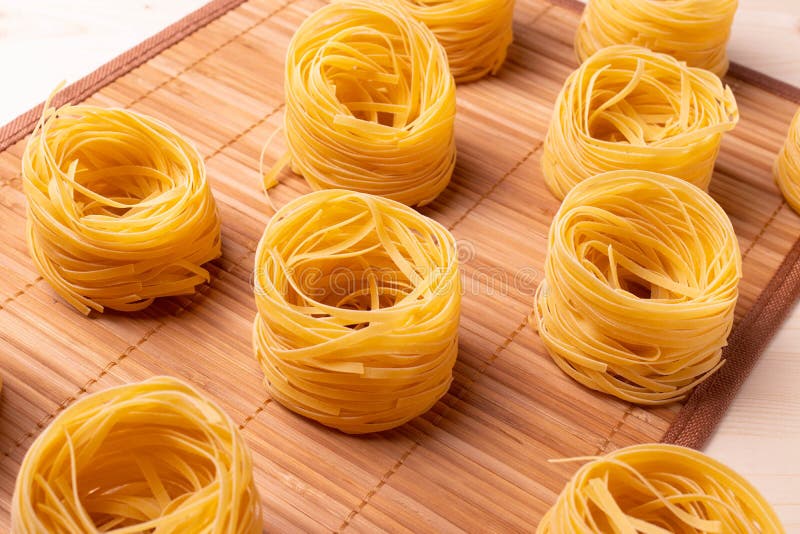 Dry Pasta Rolls and Ingredients for Making a Tomato Sauce Stock Image