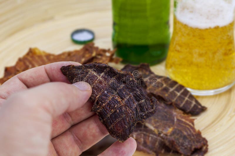 Dry Jerky Jerky for Beer. Beef Jerky in a Male Hand Stock Photo Image of delicious, drying