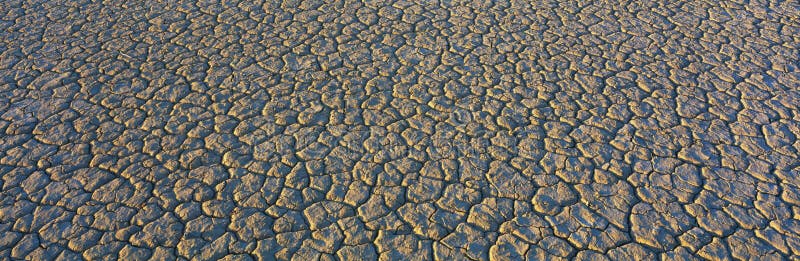 This is a dry lake bed at Cuddeback Dry Lake in the Mojave Desert. It shows a pattern from the dried mud. This is a dry lake bed at Cuddeback Dry Lake in the Mojave Desert. It shows a pattern from the dried mud.