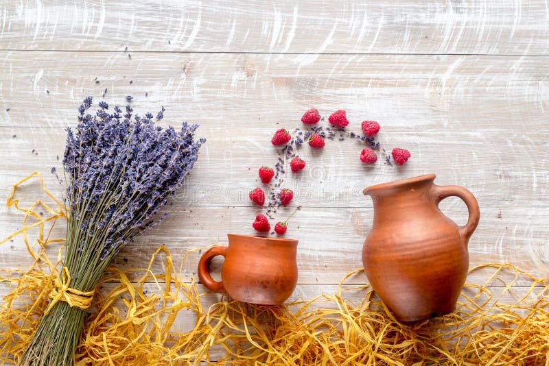 Dry laveder bouquet, raspberry and straw on wooden background top view mockup stock photography Dry laveder bouquet, raspberry and straw on wooden background top view mockup stock photography