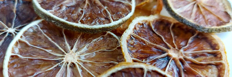 Dry lemon wedges on white background stock images
