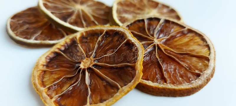 Dry lemon wedges on white background stock photography