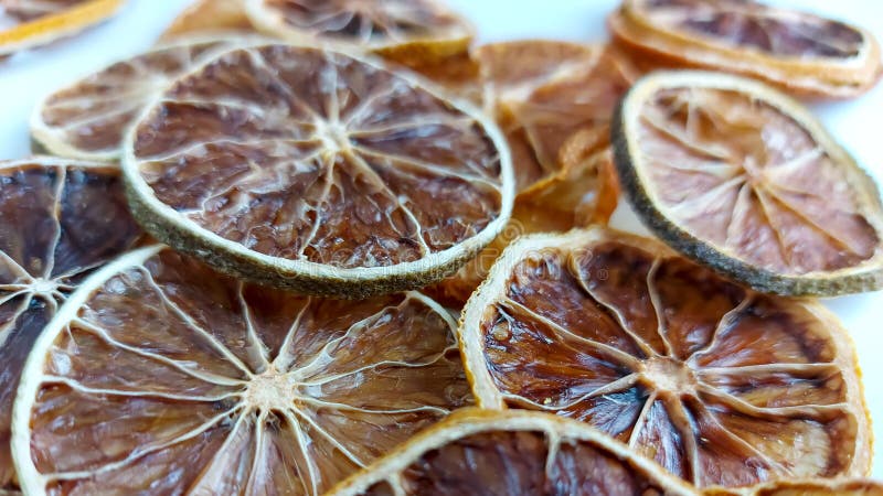 Dry lemon wedges on white background stock image