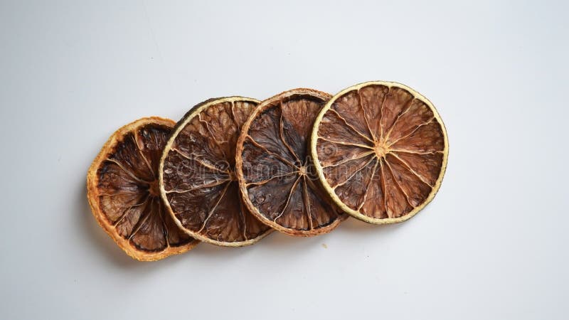 Dry lemon wedges on white background stock photo