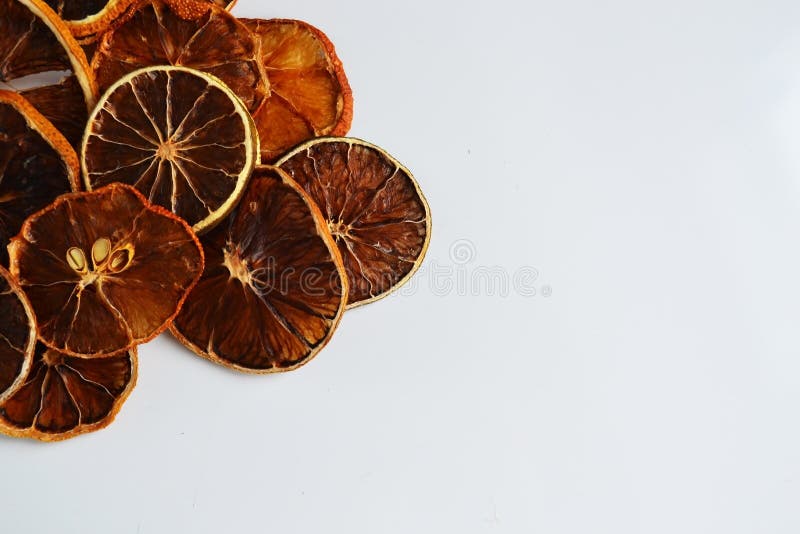 Dry lemon wedges on white background stock image