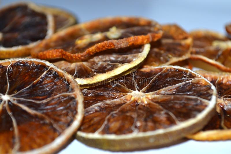 Dry lemon wedges on white background royalty free stock images