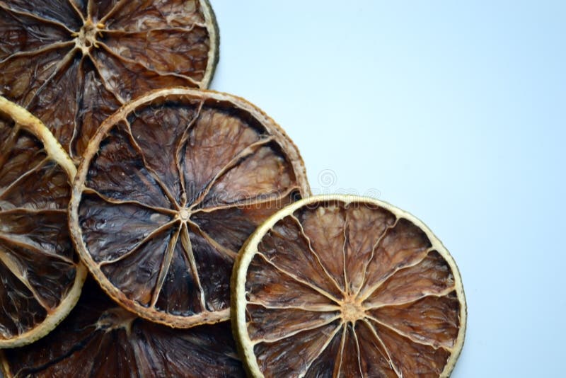 Dry lemon wedges on white background royalty free stock photo