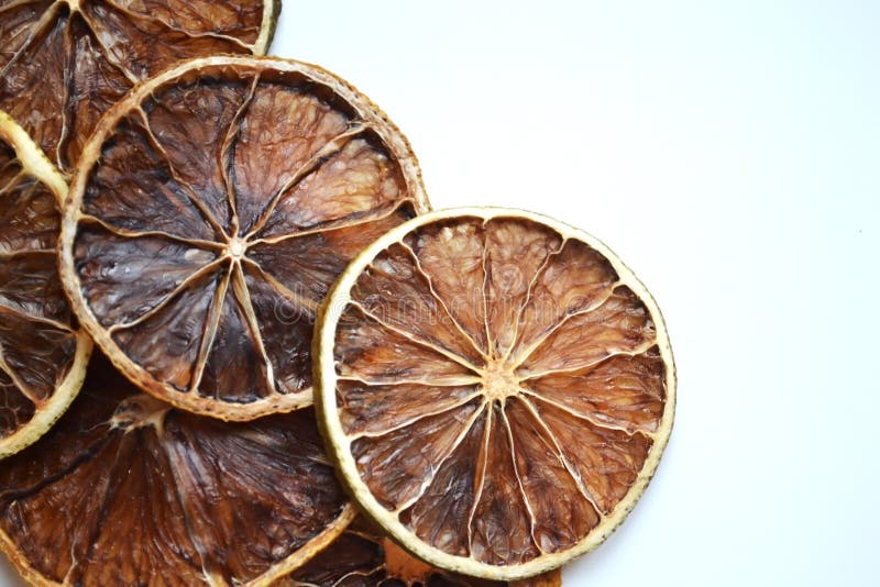 Dry lemon wedges on white background stock photo