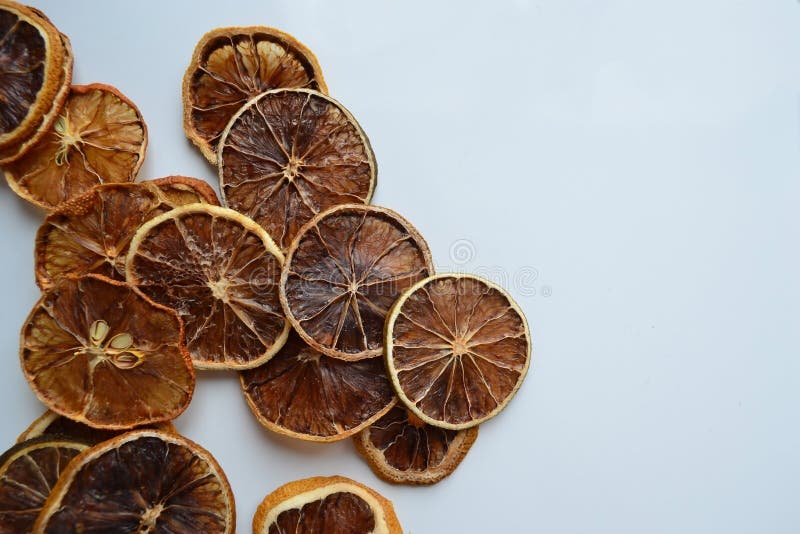 Dry lemon wedges on white background royalty free stock photography