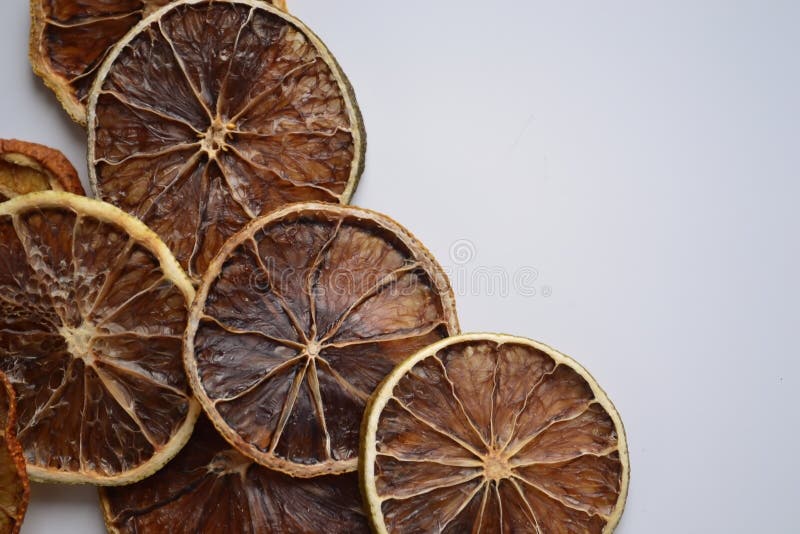Dry lemon wedges on white background stock photography