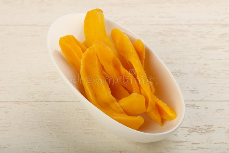 Tasty Organic Dried Mango Chips In Bowl. Healthy Food Stock Photo