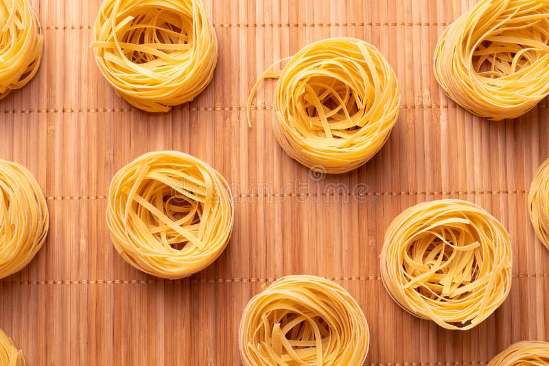 Dry Pasta Rolls and Ingredients for Making a Tomato Sauce Stock Photo