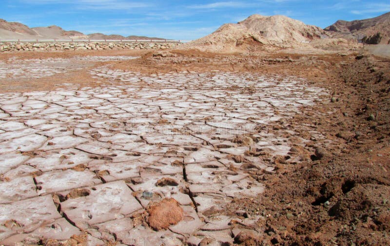 Dry salt soil in Valle de la Luna, Moon valley in San Pedro de Atacama desert. Panoramic view of empty dry solty desert soil in SanPedro de Atacama. Red rocks stock photo Dry salt soil in Valle de la Luna, Moon valley in San Pedro de Atacama desert. Panoramic view of empty dry solty desert soil in SanPedro de Atacama. Red rocks stock photo