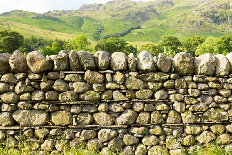 Dry stone wall north England countryside Lake District National Park Cumbria uk traditional structure with no mortar stock image Dry stone wall north England countryside Lake District National Park Cumbria uk traditional structure with no mortar stock image