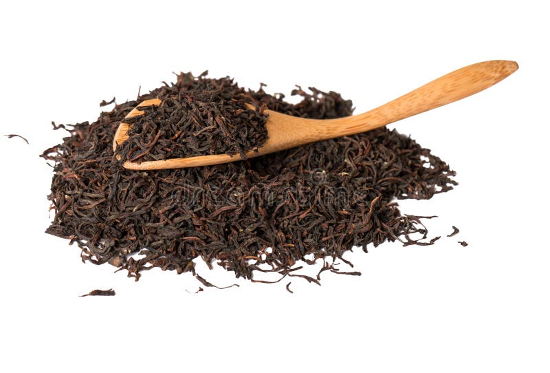 Dry tea leaves in wooden spoons isolated on white stock photography Dry tea leaves in wooden spoons isolated on white stock photography