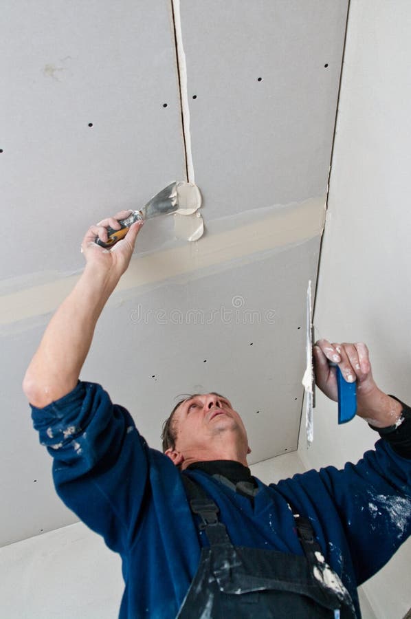 Dry waller at work stock image. Image of interior, improving 5623211