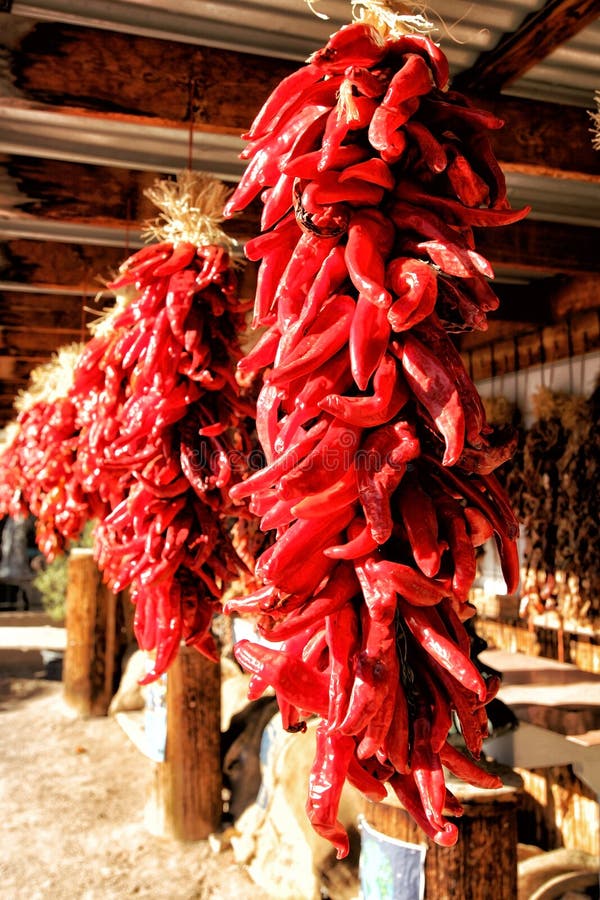 Red chilies hanging from the rafters to dry. stock photos Red chilies hanging from the rafters to dry. stock photos