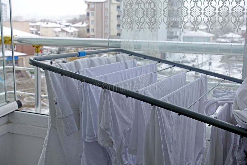 Drying Clothes on the Balcony in Winter, White Clothes Drying on the