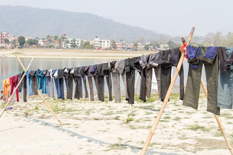 Drying clothes in the sun stock photo. Image of sand 19217354
