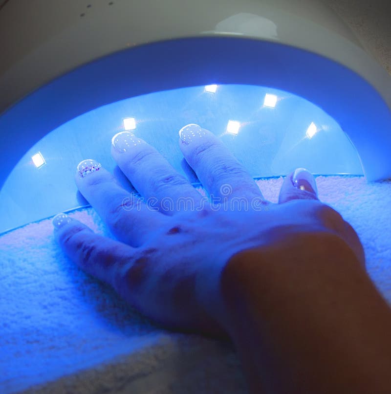 Drying in Nail Enamel Drying Device. Stock Photo Image of manicure
