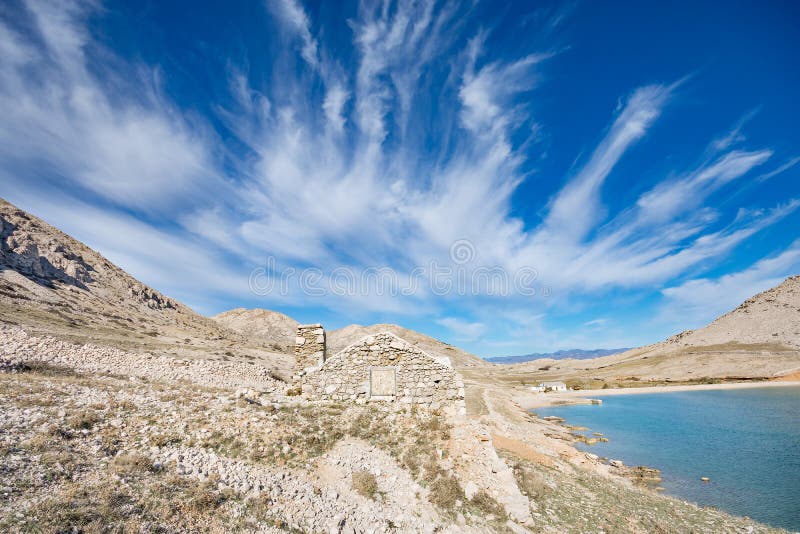 Drystone house blending into the rocky landscape of Vela Luka bay