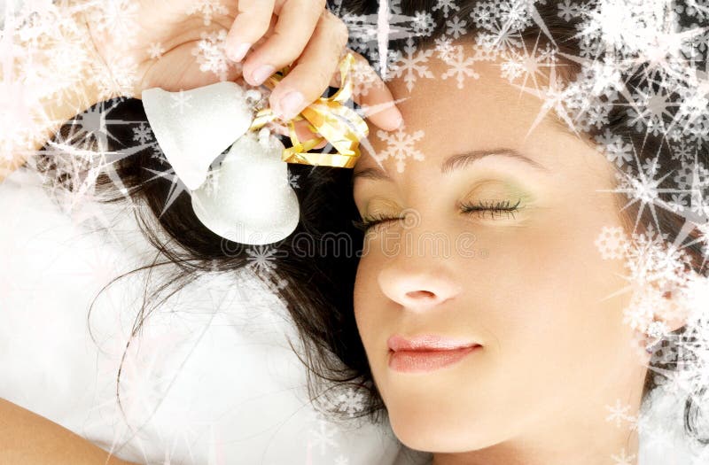 Dreaming girl with christmas bells and rendered snowflakes. Dreaming girl with christmas bells and rendered snowflakes