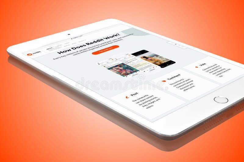 Reddit website on white Apple iPad mini digital tablet PC, isolated on orange red background.