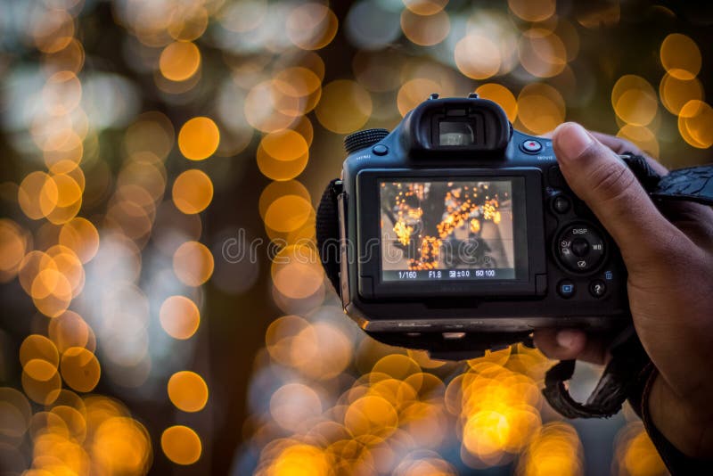 DSLR Camera on Bokeh Background Black DSLR Camera with Bokeh Lights Photo  and Camera City Lights Bokeh 1 Stock Image - Image of hobby, city: 176338951