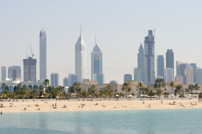 Dubai City Skyline, Jumeirah Beach Park in Foreground. United Arab Emirates