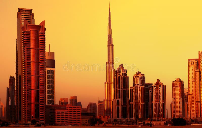 Picture of dubai downtown on sunset, arabian architecture, modern landmark,luxury building, burj khalifa in evening, beautiful cityscape in middle east, united arab emirates