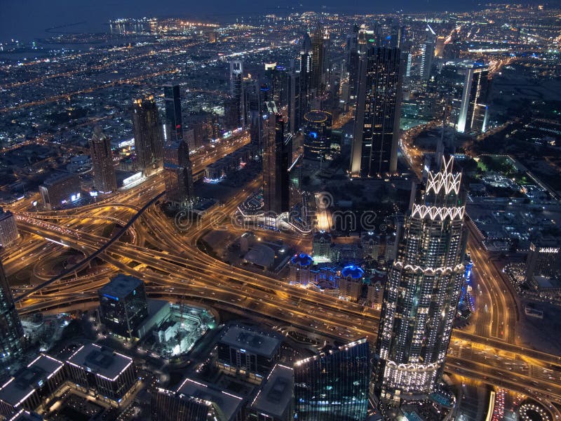 Dubai skyline seen from Burj Khalifa at night. Dubai, United Arab Emirates stock photo Dubai skyline seen from Burj Khalifa at night. Dubai, United Arab Emirates stock photo