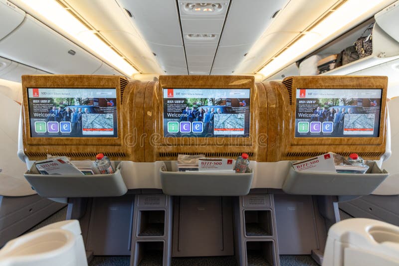 DUBAI, UAE - CIRCA 2019: Emirates airline business class interior. Emirates is the flag carriers of the United Arab Emirates and stock image DUBAI, UAE - CIRCA 2019: Emirates airline business class interior. Emirates is the flag carriers of the United Arab Emirates and stock image