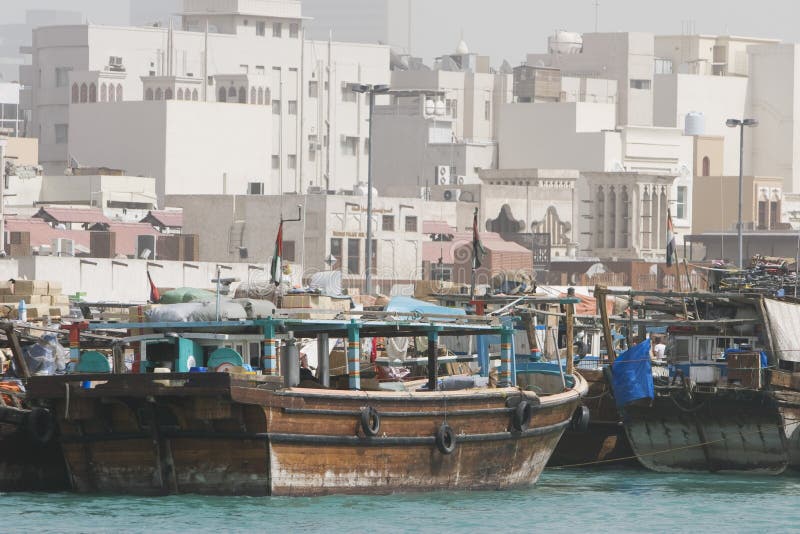 Dubai UAE Dhows old wooden sailing vessels are docked along the Deira side of Dubai Creek. stock image Dubai UAE Dhows old wooden sailing vessels are docked along the Deira side of Dubai Creek. stock image