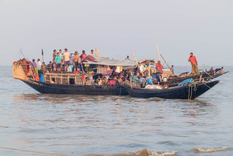 DUBLAR CHAR, BANGLADESH - NOVEMBER 14, 2016: Hindu pilgrims on their boat during Rash Mela festival at Dublar Char Dubla island