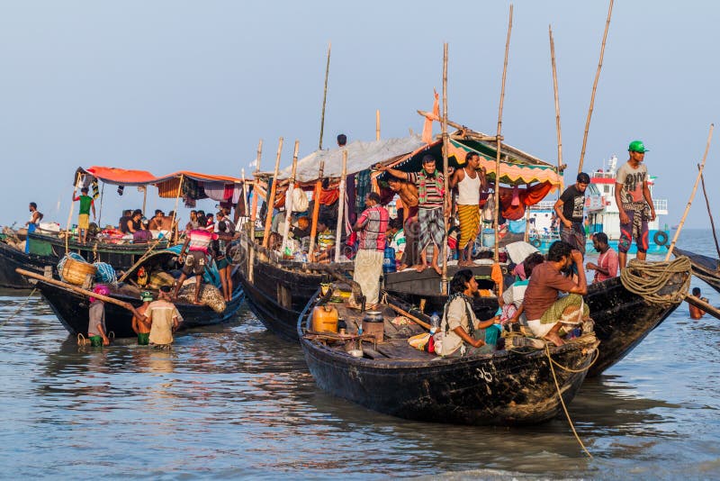DUBLAR CHAR, BANGLADESH - NOVEMBER 14, 2016: Hindu pilgrims on their boats during Rash Mela festival at Dublar Char Dubla island