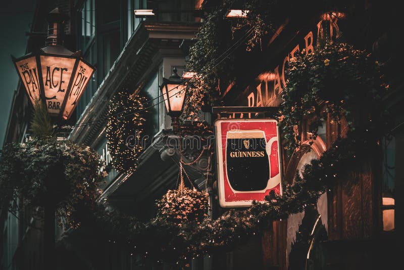 DUBLIN, IRELAND, DECEMBER 24, 2018: Close up of the exterior of the Palace Bar, decorated for Christmas on Fleet Street, with a