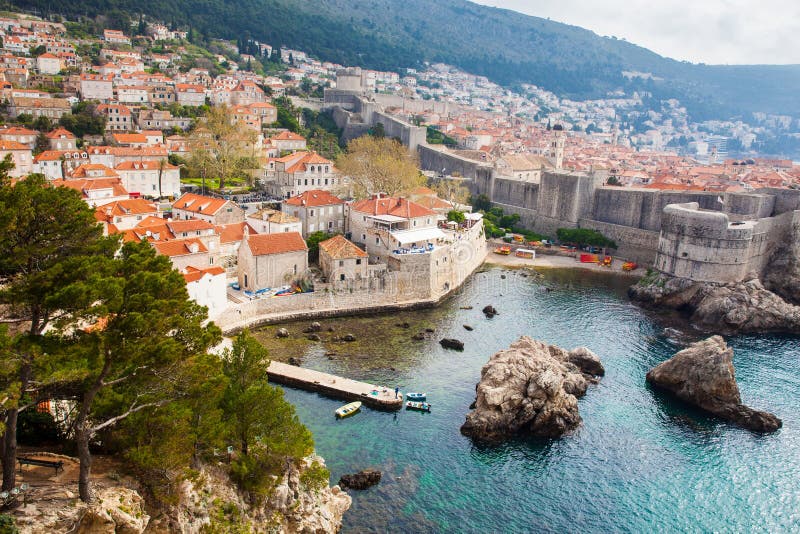 Dubrovnik West Pier and medieval fortifications of the city seen from Fort Lovrijenac stock photography Dubrovnik West Pier and medieval fortifications of the city seen from Fort Lovrijenac stock photography